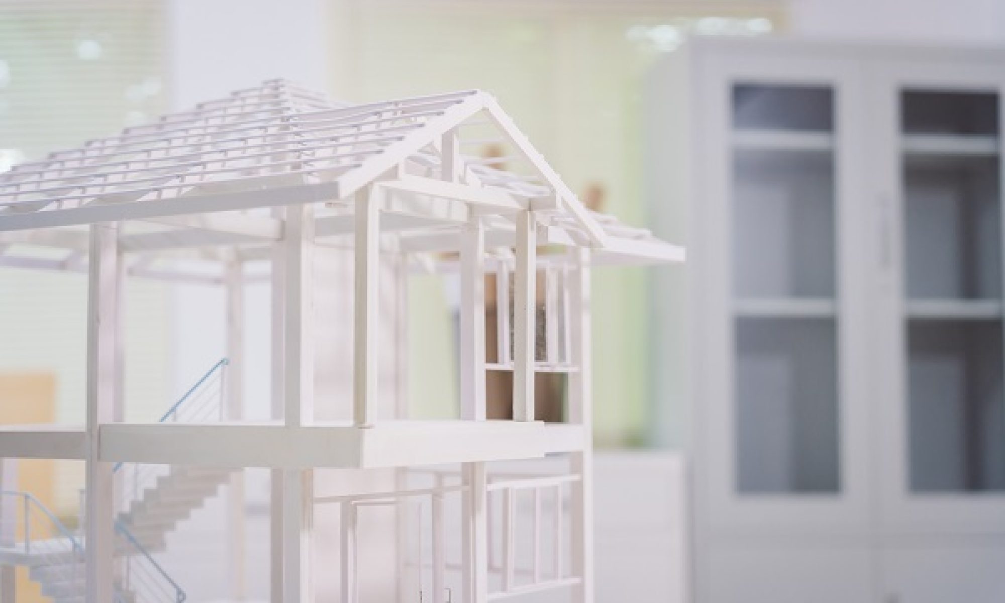 Concrete House Structure, Toy Model, Blueprints, and Tools Show Foundation, Roof, and Elements.